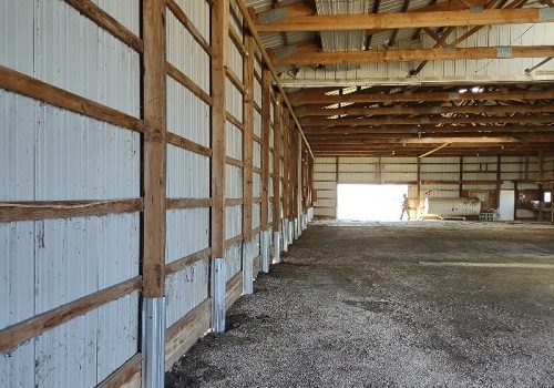 The inside of a post-frame building used for storage