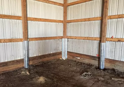 The corner of a pole barn using Anthem Built products to stabilize the columns