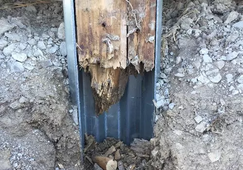 A rotted post needing Post-Frame Repair in Peoria IL