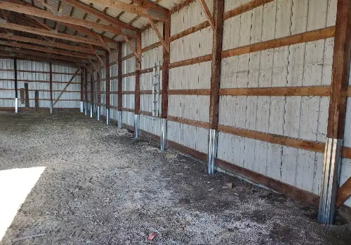 The inside of a post-frame structure after having its column's repaired using column repair sleeves. A great answer to How Do I Keep My Pole Barn Posts from Rotting?