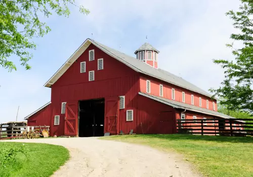 A red pole barn in Illinois after being stabilized using Anthem Built products