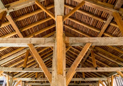 The inside trusses of a post-frame building in Illinois