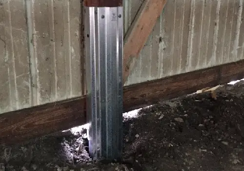 A repair sleeve on a post, helping with Pole Barn Post Repair in Peoria IL