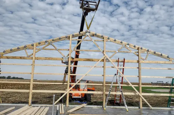 A member of Anthem Built who has become an installer works on building a barn
