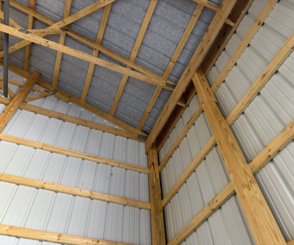 the inside of a pole barn, which needs protection with the help of Anthem Built if you're searching "How Do I Keep My Pole Barn Posts from Rotting?"
